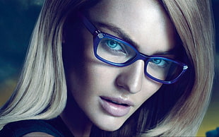 woman wearing blue frame eyeglasses